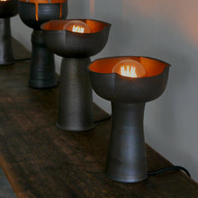 Load image into Gallery viewer, A handmade modern minimalist ceramic lamp by Hong Kong artist Clara, showcased in a local pottery shop. Featuring clean lines and simple design, it complements contemporary home decor. 手工製作的現代簡約陶瓷燈,由香港藝術家Clara設計,線條簡潔,適合現代家居。